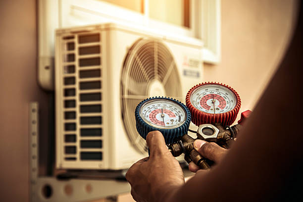 Professional Air Conditioning Service technician working in Lakeside, MT